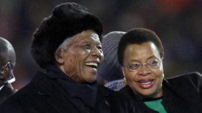 Nelson Mandela and his wife Graca are driven across the field ahead of the World Cup final in July 2010