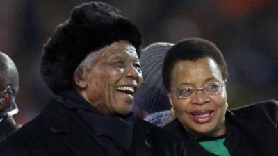 Nelson Mandela and his wife Graca are driven across the field ahead of the World Cup final in July 2010