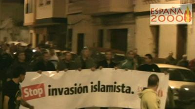 Espana2000 members hold a banner