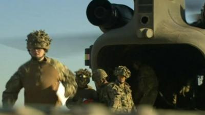 British soldiers and helicopter in Afghanistan