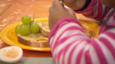 Child at a breakfast club