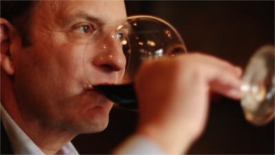 Paul Lukacs drinking wine