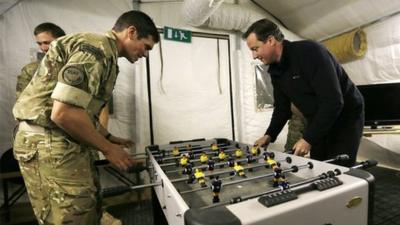 David Cameron plays table football with soldiers in Afghanistan