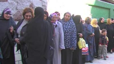 Women queue to vote