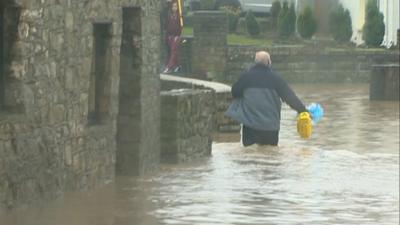 Man in floodwater