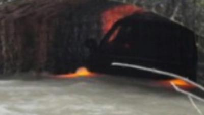 Car under bridge