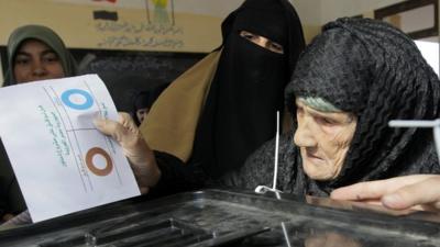 Amnah Sayyed Moussa casts her vote