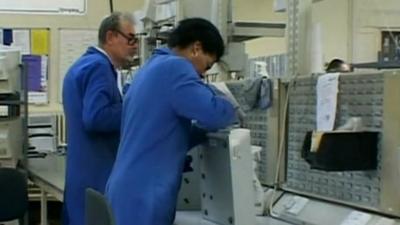 People in Remploy factory refurbishing computers