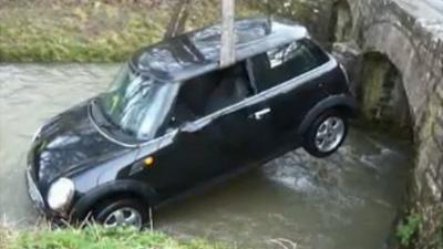 The car being lifted from the river