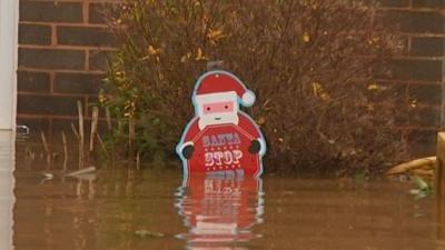 Santa decoration submerged in flood water