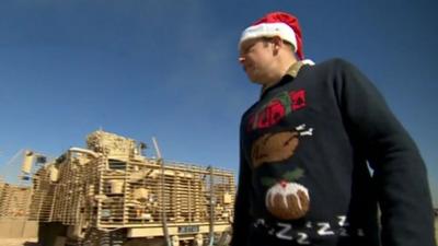 British serviceman wearing Christmas jumper in Afghanistan