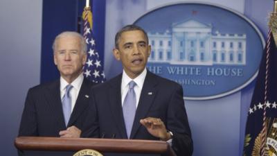 President Barack Obama, with Vice-President Joe Biden at his side, makes a statement regarding the passage of the fiscal cliff bill in the press briefing room at the White House in Washington, 1 January 2013