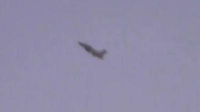 Burma military jet in sky over Kachin