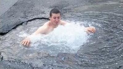 Liam Keane has a swim in a pothole