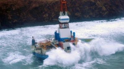 Shell oil rig Kulluk seen grounded off the coast of an Alaskan island