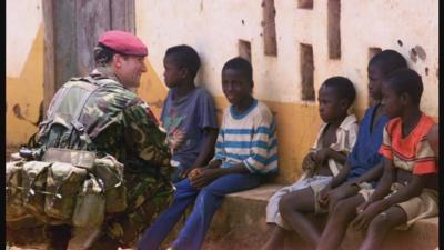 British para near Lungi airport speaks to children in 2000