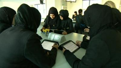 School pupils use iPads