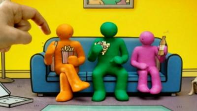 Advert showing three characters eating junk food