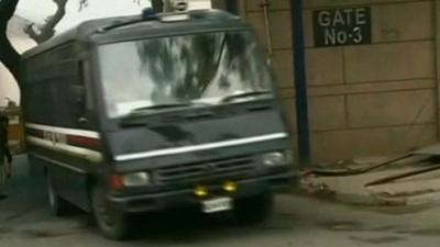 Police van carrying the men accused of the gang-rape and murder of a medical student