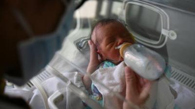 Feeding a baby in China