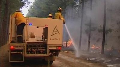 Australian fire fighters tackle blaze