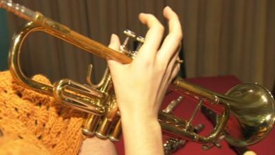 Playing a trumpet