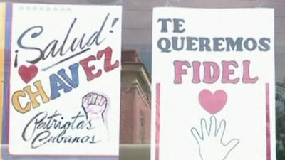 Posters saying 'Salud Chavez' and 'Te Queremos Fidel'