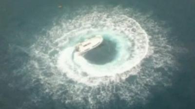 Boat caught in spin off coast of Perth, Australia