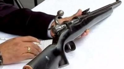 A gun being exchanged in Mexico