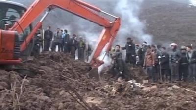 Rescuers work after the landslide