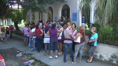 Queue outside passport office in Cuba