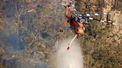 Helicopter dumping water