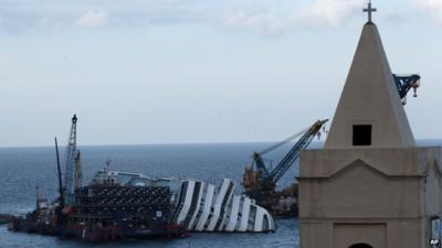 The Costa Concordia cruise ship leans on its side off the Tuscan Island Isola del Giglio, Italy