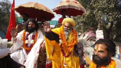 Sadhus, or Hindu holy men, arrive in a religious procession to participate in the Kumbh Mela