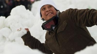 An attendee prepares to hurl a snowball