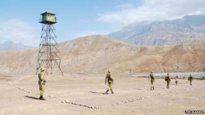 Tajik border guards set out to patrol the border with Afghanistan