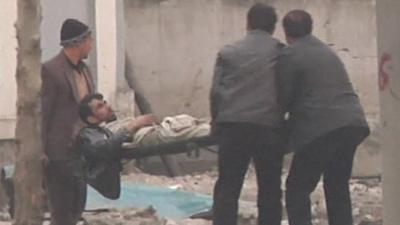 Wounded in Kabul being stretchered off