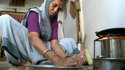 Woman cooking in India