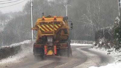 A gritting lorry in the snow