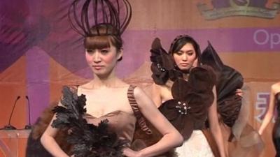 Models wear outfits made partly from chocolate