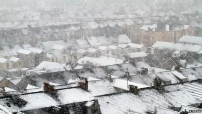 Snow on homes in Swansea