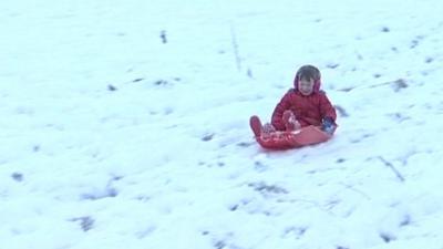 Child on sledge