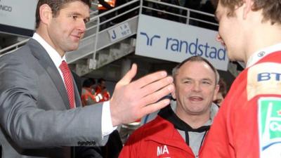 Johann Muller and Mark Anscombe congratulate Iain Henderson's after Ulster's win in France