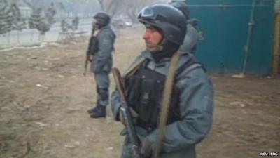 Afghan soldiers hold weapons