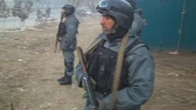 Afghan soldiers hold weapons