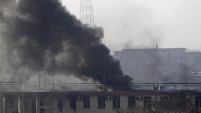 Smoke rises from the Kabul traffic police headquarters during an insurgents' attack on Monday 21 January 2013