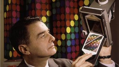 Edwin Land with a Polaroid camera