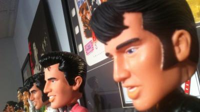 Elvis Presley dolls sitting on a shelf