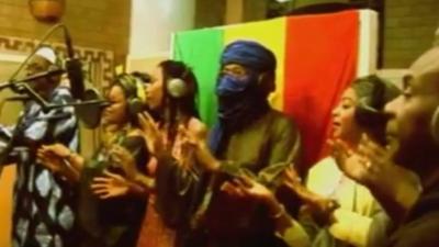 Malian singers recording a song calling for peace