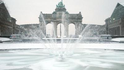 A fountain sprays water during freezing temperatures at the Cinquantenaire park in Brussels